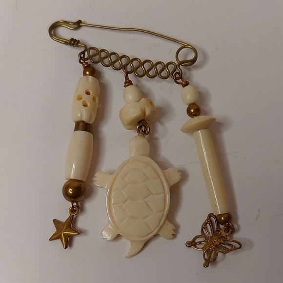 Vintage Jewelry - Vintage Carved Bone and Brass Dangling Charms Brooch Pin